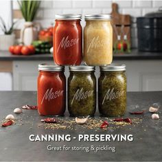 four jars filled with food sitting on top of a counter