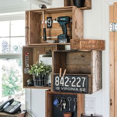 a wooden crate filled with lots of different types of tools and things on top of it