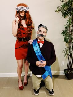 a man and woman dressed up in costumes