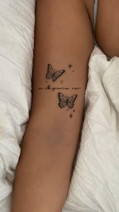 a woman's arm with two butterflies and the words, i am so beautiful