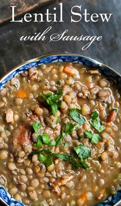 lentil stew with sausage and parsley in a blue bowl on a wooden table