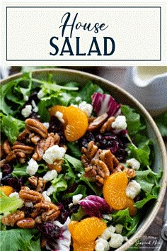 a salad with oranges, feta cheese and pecans