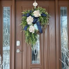 a wreath is hanging on the front door