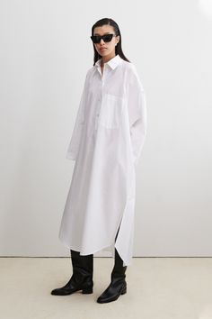 Crisp cotton long sleeve shirt dress with a classic collar, button-down front, and breezy side slits. Features an oversized breast pocket and a distinctive square seam on the back, for a touch of interest. Roll up the sleeves for a laid-back look. This dress has a large, oversized fit. We recommend sizing down. 100% Or Shirt Dress Oversized, Oversized Collar Dress, Oversized Collar, Cotton Long Sleeve Shirt, White Shirt Dress, Long Sleeve Shirt Dress, Black Xs, Short Jumpsuit, Knit Skirt