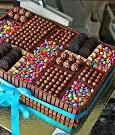 a chocolate cake with candy and candies on it