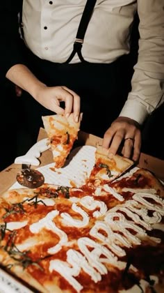 a person cutting into a pizza with the word gourmet written on it