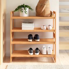 This shoe rack helps you organize your entryway or mudroom and keep it clutter-free. Made from solid bamboo, it comes in an inviting natural finish that brings an understated feel anywhere. Four slatted shelves provide enough room for 12 pairs of shoes, from boots to sandals. We love its versatility: This rack separates into two pieces, so you can place them beside one another or stack them to save on floor space in tighter spots around your home Diy Shoe Rack Ideas, Slatted Shelves, Mudroom Organization, Diy Shoe Rack, Stackable Shoe Rack, Rack Design, Garment Racks