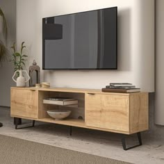 a flat screen tv mounted to the side of a wooden entertainment center in a living room