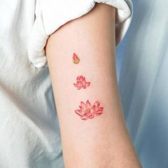 a woman's arm with pink flowers on it