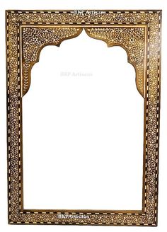 an ornate wooden frame with carvings on the sides and gold trimmings around it