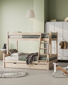 a wooden bunk bed sitting on top of a floor next to a white dresser and chair