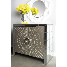 a mirrored cabinet with yellow flowers on top and a mirror above the door that says, posh home accents la croisette cabinet