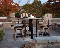 an outdoor table and chairs set up outside