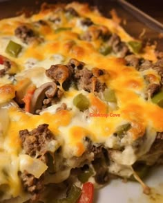 a casserole dish with meat, cheese and vegetables