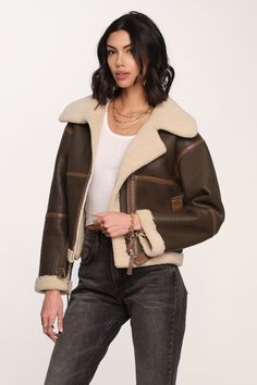 The Olina Jacket is made from a bonded shearling faux fur, and trimmed in a contrast faux leather at seams and pockets. It has a cool, relaxed fit and center front zip closure. Layer this over any outfit to add a touch of cool. Bonded fabric Relaxed fit Zipper closure Faux leather Length: 23.5" from high point of shoulder (Size S) 55% Viscose | 45% Polyurethane Model is 5'9" and wearing size XS Faux Leather Jacket Women, Biker Coat, Womens Black Leather Jacket, Aviator Jacket, Aviator Jackets, Pull & Bear, Brown Jacket, Leather Blazer, Black Leather Jacket