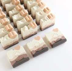 several different types of soaps sitting on top of each other in front of a white background