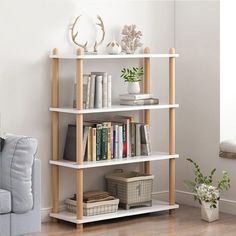 a book shelf with books on it in a living room