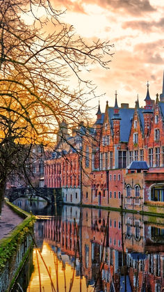 the reflection of buildings in the water is very colorful and beautiful at sunset or dawn