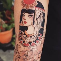 a woman's arm with a tattoo on it and an apple above her head