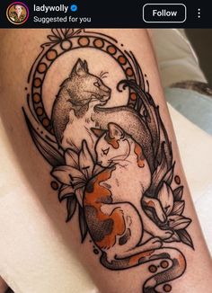 a tattoo on the leg of a woman with an orange and white fish in it