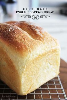 a loaf of homemade english cottage bread on a cooling rack with the words homemade english cottage bread above it