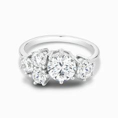 three stone diamond ring on white background