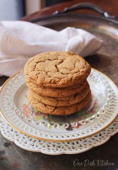 a stack of cookies sitting on top of a white plate