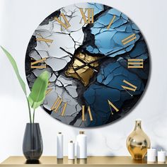 a clock that is on the wall next to a vase with a plant in it