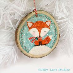 a christmas ornament with a red fox on it