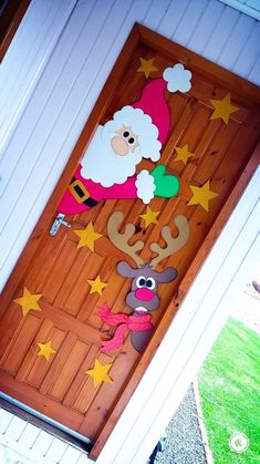 a door decorated with santa claus and reindeer