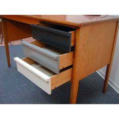 an office desk with two drawers on it