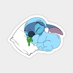 stitcher sleeping on the pillow with his stuffed animal in it's mouth sticker