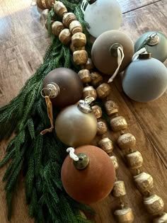 christmas ornaments are arranged on a wooden table