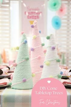 three felt christmas trees sitting on top of a table next to plates and napkins