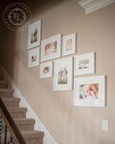 a staircase with pictures hanging on the wall