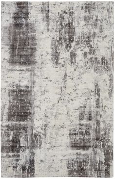 an area rug with grey and white colors