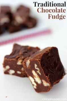 two pieces of chocolate fudge on a white plate