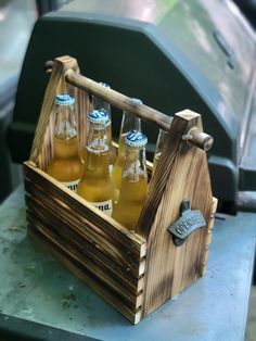 six bottles of beer in a wooden crate