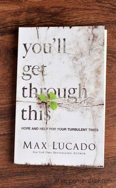 the book you'll get through this by max luciao on a wooden table