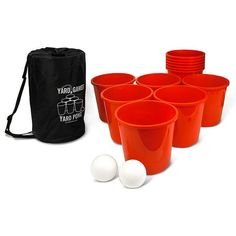 red plastic cups with white balls in front of black drawstring bag and carrying case