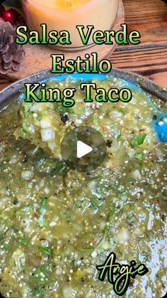 salsa verde estilo king taco in a pan with a candle on the side