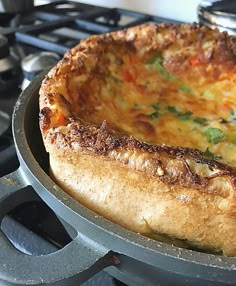 a cheesy dish sitting on top of a stove