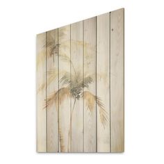 a wooden wall with palm trees painted on the wood planks in beige and white