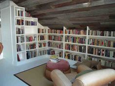 a living room filled with lots of books