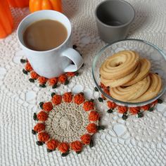 there are some cookies and coffee on the table