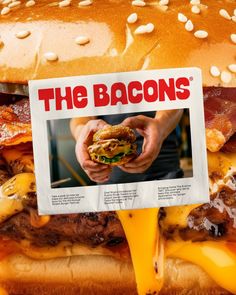 a bacon cheeseburger on a bun with the bacons sign in front of it