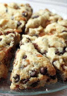 chocolate chip scones are on a glass plate