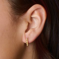 Pavé right this way with our stylish gold huggies. These dainty pearl earrings hug tightly around the earlobe. Perfect for stacking with more huggies, studs or ear cuffs.  Pearl is also known as June birthstone.  Hypoallergenic, nickel and lead-free; Tarnish resistant. Made of 14K gold plated sterling silver with 5 freshwater pearls.  Our jewelry is designed to be water-resistant, so you don't have to worry about taking it off when you're near water. However, we recommend limiting prolonged exposure to water to keep your jewelry looking its best. When you're not wearing your pieces, we suggest storing them in the original Little Sky Stone pouch in a cool, dry place to help maintain their luster and extend their lifespan. Dainty Pearl Earrings, Stocking Fillers For Him, Gold Huggies, Stocking Fillers For Her, June Birthstone, Ear Cuffs, Huggie Earrings, June Birth Stone, Beauty Cosmetics