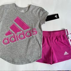 Adidas Girls Matching Set 2 Piece Set, Shirt And Shorts Size 4, Color Gray And Pink New With Tags Pink Adidas Cotton Set, Adidas Pink Cotton Sets, Pink Cotton Adidas Sets, Casual Adidas Sets For Spring, Pink Short Sleeve Sports Set, Adidas Pink Playwear Sets, Casual Pink Sports Sets, Adidas Pink Sets For Spring, Adidas Pink Fitted Sets