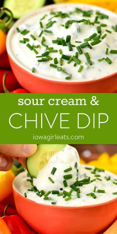 two bowls filled with sour cream and chive dip surrounded by peppers, cucumbers, and lemons